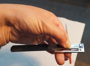 Preparing to rivet a reed tongue